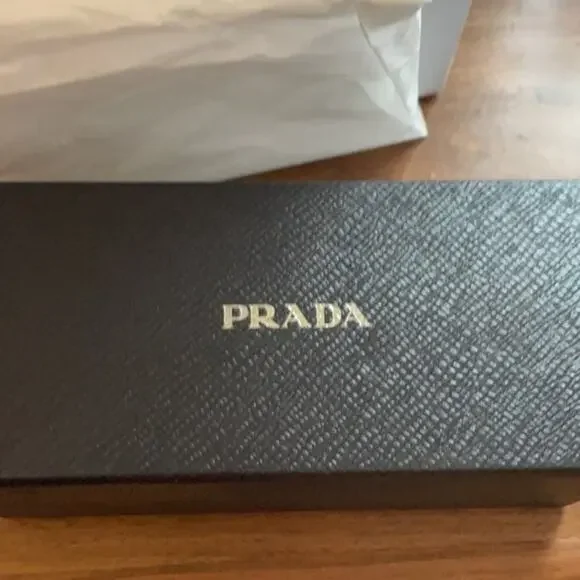 Prada 61mm Oval Sunglasses silver